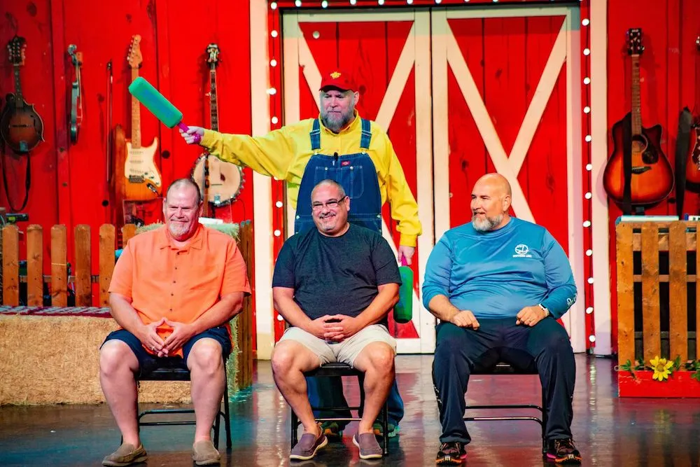 audience members on stage at The Comedy Barn