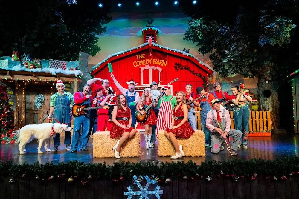 Cast on stage during Comedy Barn Christmas